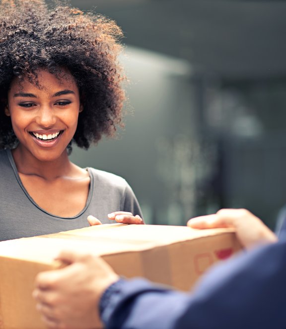 Happy woman receiving parcel