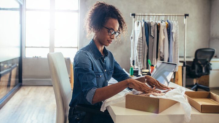 Ecommerce owner packing a delivery