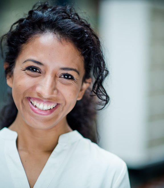 Woman in white shirt smiling