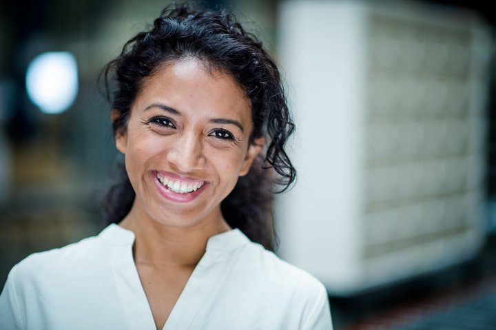 Woman in white shirt smiling